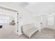 Upstairs loft area with a couch and a view of the adjacent room with desk and chair at 7316 Hamilton Bridge Rd, Charlotte, NC 28278