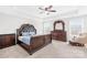 Spacious bedroom with tray ceiling, elegant furniture, and windows with lots of natural light at 7316 Hamilton Bridge Rd, Charlotte, NC 28278