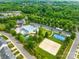 Aerial view of the neighborhood amenities including a swimming pool, sports courts, and play area at 7316 Hamilton Bridge Rd, Charlotte, NC 28278