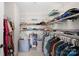 Organized walk-in closet with ample shelving and hanging space for clothes and accessories at 7316 Hamilton Bridge Rd, Charlotte, NC 28278