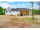 Expansive backyard view showcasing the home's rear elevation and covered deck at 762 Highway 274 Hwy, Clover, SC 29710