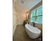 Modern bathroom with soaking tub, granite counters and natural lighting at 762 Highway 274 Hwy, Clover, SC 29710