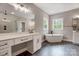 Modern bathroom featuring double vanities, freestanding tub, and a separate glass-enclosed shower at 762 Highway 274 Hwy, Clover, SC 29710