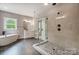 Elegant bathroom with a glass-enclosed shower, modern fixtures, and a freestanding tub at 762 Highway 274 Hwy, Clover, SC 29710