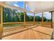 Large wooden deck with railing, offering picturesque outdoor views and an ideal space for entertaining at 762 Highway 274 Hwy, Clover, SC 29710