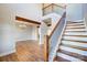 Open two-story foyer with hardwood floors, decorative chandelier, and wooden stairs with metal railings at 762 Highway 274 Hwy, Clover, SC 29710