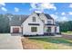 Beautiful two-story modern farmhouse with a three car garage and an inviting front porch at 762 Highway 274 Hwy, Clover, SC 29710