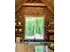 Bright farmhouse sink with brick backsplash, open shelving, and a lovely wooded view at 762 Highway 274 Hwy, Clover, SC 29710