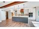 Open kitchen featuring a large island, stainless steel appliances, white cabinetry, and hardwood floors at 762 Highway 274 Hwy, Clover, SC 29710