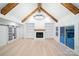 Large living room with high ceilings, exposed beams, fireplace, built-in shelves, and sliding glass doors at 762 Highway 274 Hwy, Clover, SC 29710