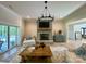 Cozy living room with a stone fireplace, wood flooring, and a sliding door to the backyard at 762 Highway 274 Hwy, Clover, SC 29710