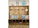 Rustic mudroom bench with storage, featuring a wooden frame, blue pillows, and decorative accents at 762 Highway 274 Hwy, Clover, SC 29710