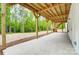 A covered patio with wooden beams and a concrete floor, great for outdoor entertainment at 762 Highway 274 Hwy, Clover, SC 29710