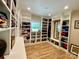 Large walk-in closet with custom shelving, wood floors, and a window for natural light at 762 Highway 274 Hwy, Clover, SC 29710