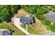 Aerial view of a beautiful home surrounded by lush greenery with a winding driveway at 7768 Pinecone Ln, Hickory, NC 28602