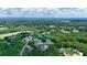 Expansive aerial view showcasing the community nestled among lush green trees and rolling hills in the distance at 7768 Pinecone Ln, Hickory, NC 28602