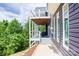 Relaxing covered deck featuring comfortable seating, and offering serene views of the surrounding landscape at 7768 Pinecone Ln, Hickory, NC 28602