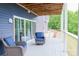 Comfortable outdoor seating on a covered deck, perfect for enjoying the outdoors with a view at 7768 Pinecone Ln, Hickory, NC 28602