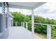 Spacious outdoor deck offering serene views of the surrounding lush greenery at 7768 Pinecone Ln, Hickory, NC 28602