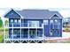Stunning blue home with multiple decks offering outdoor living and entertaining spaces at 7768 Pinecone Ln, Hickory, NC 28602