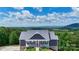 Beautiful home with a red front door and mountain views at 7768 Pinecone Ln, Hickory, NC 28602