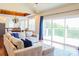 Open-concept living room with vaulted ceilings, large windows, and a spacious layout flowing into the kitchen at 7768 Pinecone Ln, Hickory, NC 28602