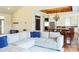 Bright open-concept living room featuring a large sectional sofa and seamless transition to the kitchen at 7768 Pinecone Ln, Hickory, NC 28602