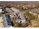 An aerial view of a residential neighborhood featuring modern townhomes surrounded by lush greenery and mature trees at 7908 Rea View Ct, Charlotte, NC 28226