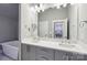 Bathroom with double vanity sinks and a large mirror at 7908 Rea View Ct, Charlotte, NC 28226