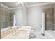 Bright bathroom featuring marble countertop, spacious mirror, and tile shower at 7908 Rea View Ct, Charlotte, NC 28226