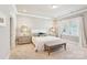 This bedroom boasts neutral colors, plush carpet, and lots of natural light at 7908 Rea View Ct, Charlotte, NC 28226