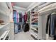 Walk-in closet with ample shelving and hanging space for storage at 7908 Rea View Ct, Charlotte, NC 28226