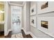 Hallway with wood floors, framed photographs, and an open view into the adjacent dining area at 7908 Rea View Ct, Charlotte, NC 28226