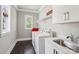 Laundry room with a utility sink and bright natural light at 7908 Rea View Ct, Charlotte, NC 28226
