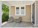 Inviting porch with comfortable seating, a decorative rug, and pleasant curb appeal at 7908 Rea View Ct, Charlotte, NC 28226