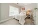 Cozy bedroom with neutral color scheme and a large window with blinds at 815 Jetton St, Davidson, NC 28036