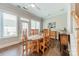 Light and airy dining room features wood floors and view to the exterior at 815 Jetton St, Davidson, NC 28036