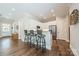 Modern kitchen with white cabinets, stainless steel appliances, and bar seating at 815 Jetton St, Davidson, NC 28036
