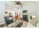 Spacious living room with a fireplace, hardwood flooring, and high ceilings at 815 Jetton St, Davidson, NC 28036