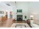 Bright living room boasting a fireplace, hardwood flooring, and abundant natural light at 815 Jetton St, Davidson, NC 28036