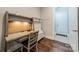 Functional office area with built-in desk, wooden floors and natural light at 815 Jetton St, Davidson, NC 28036