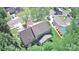 Birds eye view of a well-maintained home, featuring a backyard patio and mature trees at 8532 Piccone Brook Ln, Charlotte, NC 28216