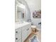 Traditional bathroom with a white vanity, patterned rug, and ample storage at 8532 Piccone Brook Ln, Charlotte, NC 28216