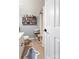 Clean bathroom with tiled floors, a shower, and a shelf full of products at 8532 Piccone Brook Ln, Charlotte, NC 28216