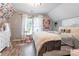 Bright bedroom with fun decorations, a comfortable bed, and hardwood floors at 8532 Piccone Brook Ln, Charlotte, NC 28216