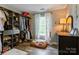 Walk-in closet with built-in shelving, clothing racks, and natural light at 8532 Piccone Brook Ln, Charlotte, NC 28216