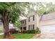 Traditional two-story home boasts a well-kept lawn, trimmed hedges, and attached two-car garage at 8532 Piccone Brook Ln, Charlotte, NC 28216