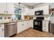 Beautiful kitchen featuring white cabinets, modern appliances, and granite countertops at 8532 Piccone Brook Ln, Charlotte, NC 28216