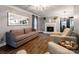 Elegant living room featuring a fireplace, hardwood floors, and neutral décor perfect for relaxation at 8532 Piccone Brook Ln, Charlotte, NC 28216