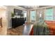 Spacious bedroom featuring hardwood floors, plants, and ample natural light at 8532 Piccone Brook Ln, Charlotte, NC 28216